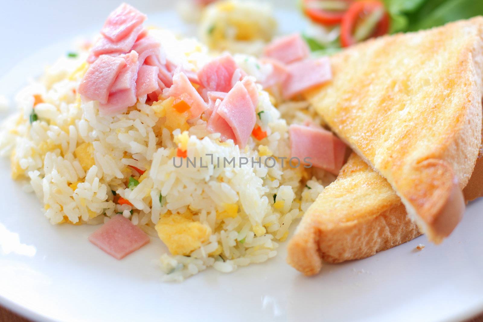 Fried rice with ham, served with toast