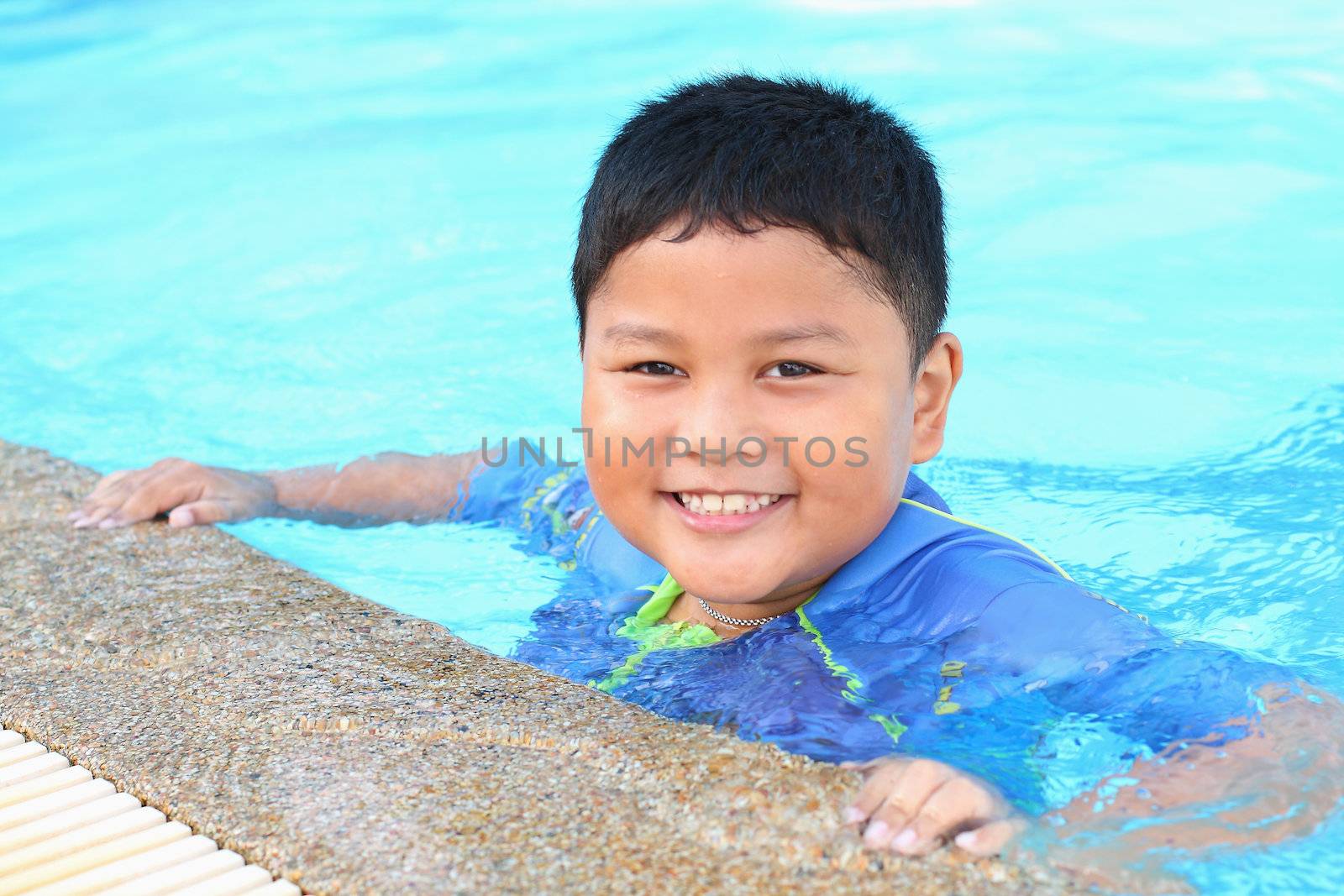 The boy was swimming in the pool. by myrainjom01