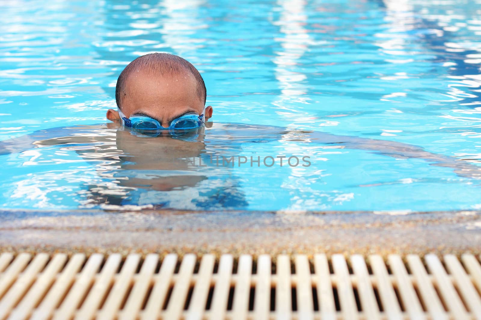 Bald men are swimming.