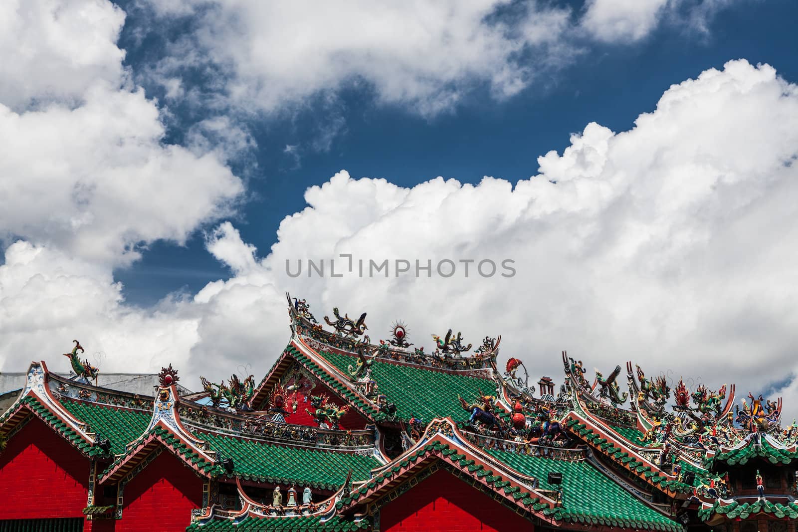 chinese temple roofs and dramatic clouds by juhku