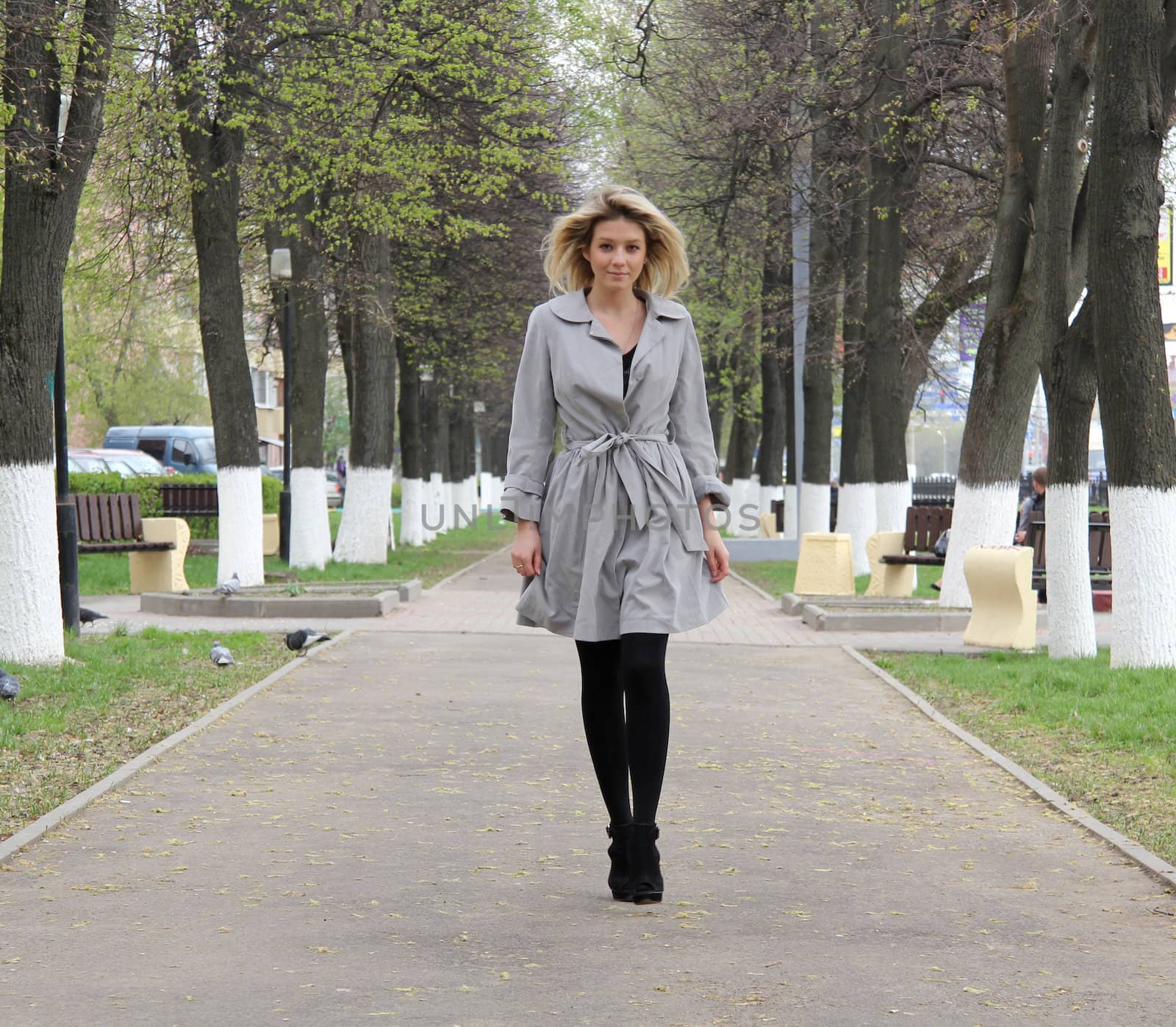 beautiful young woman walking on the street