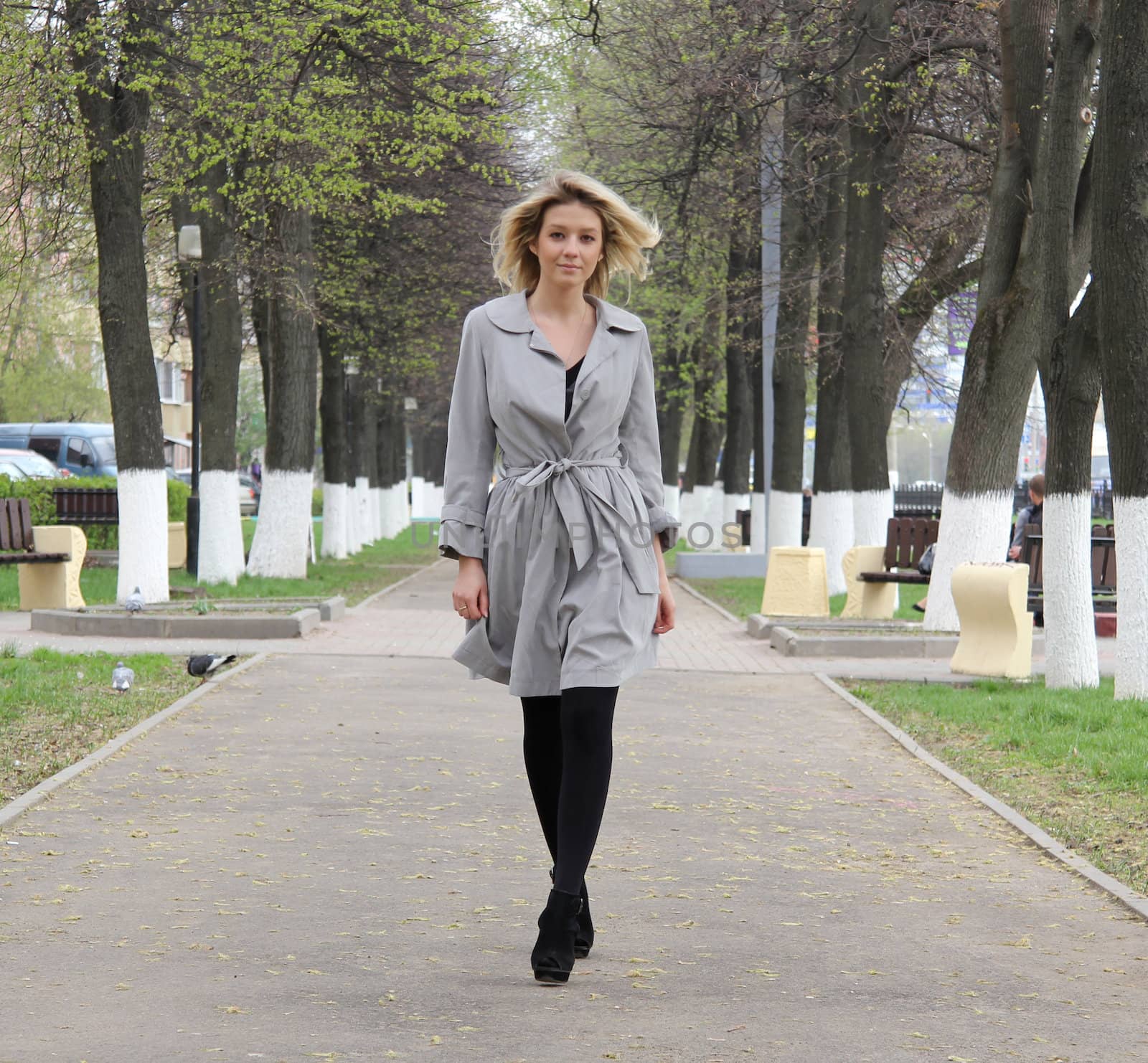 beautiful young woman walking on the street