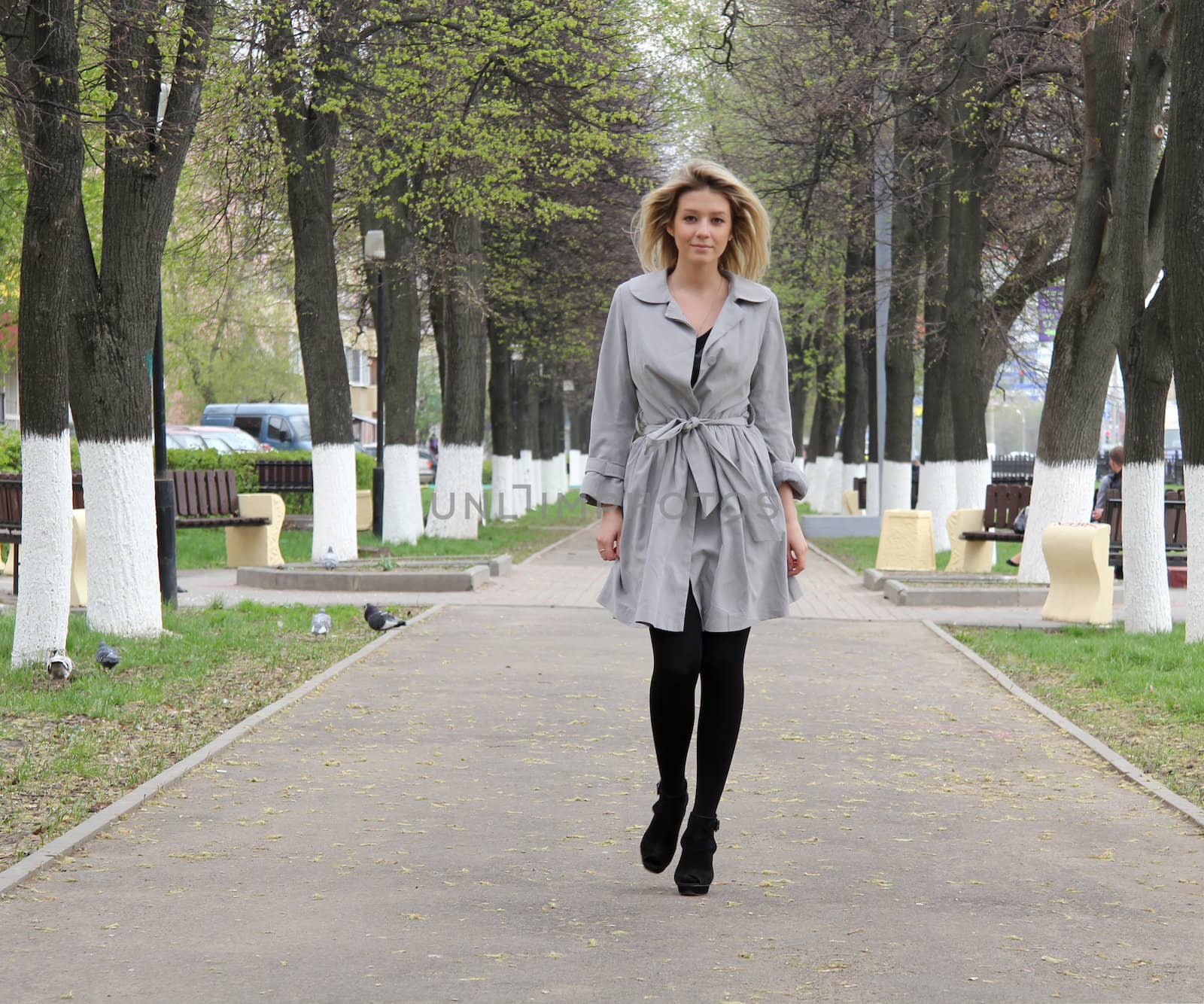 beautiful young woman walking on the street