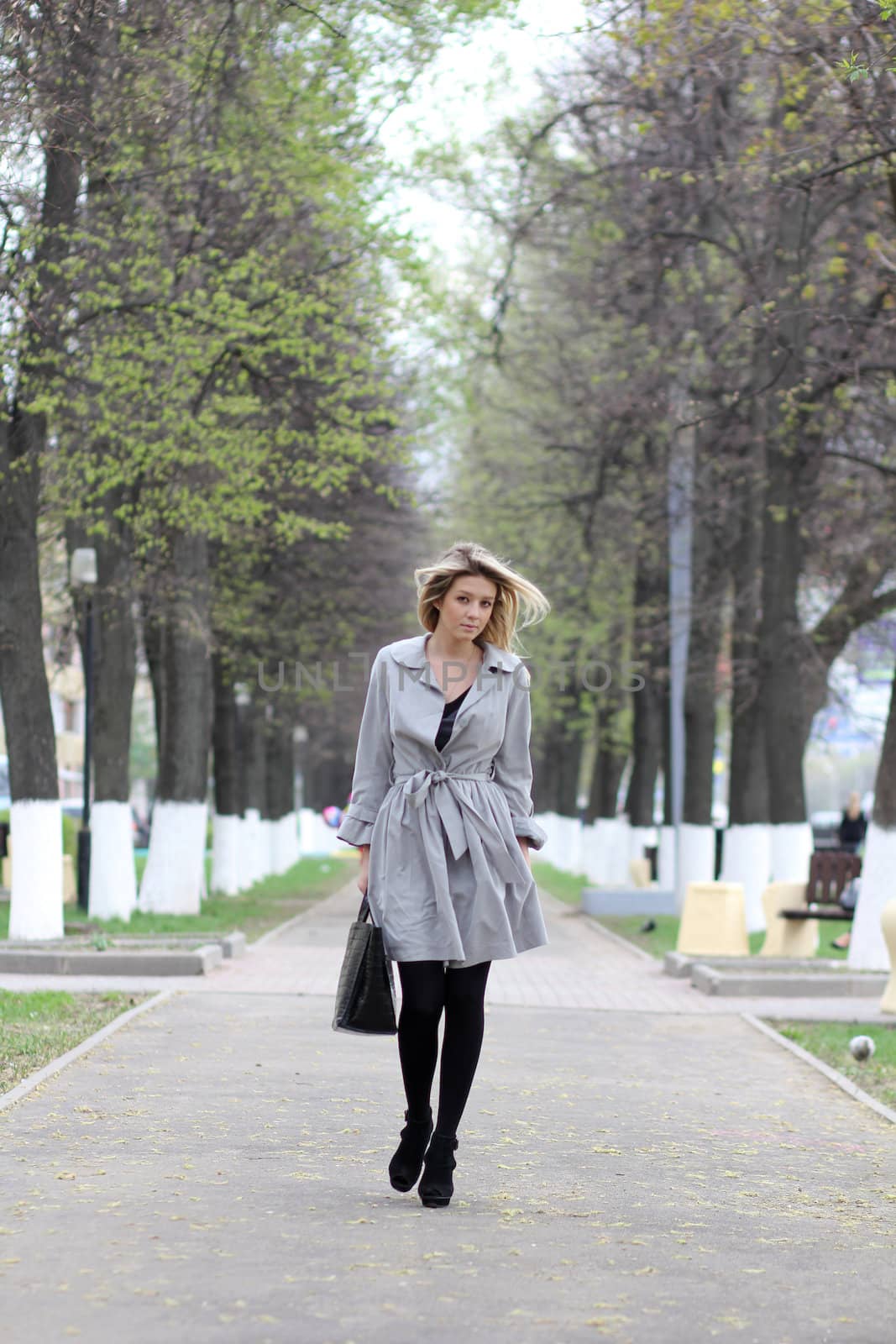 beautiful young woman walking on the street