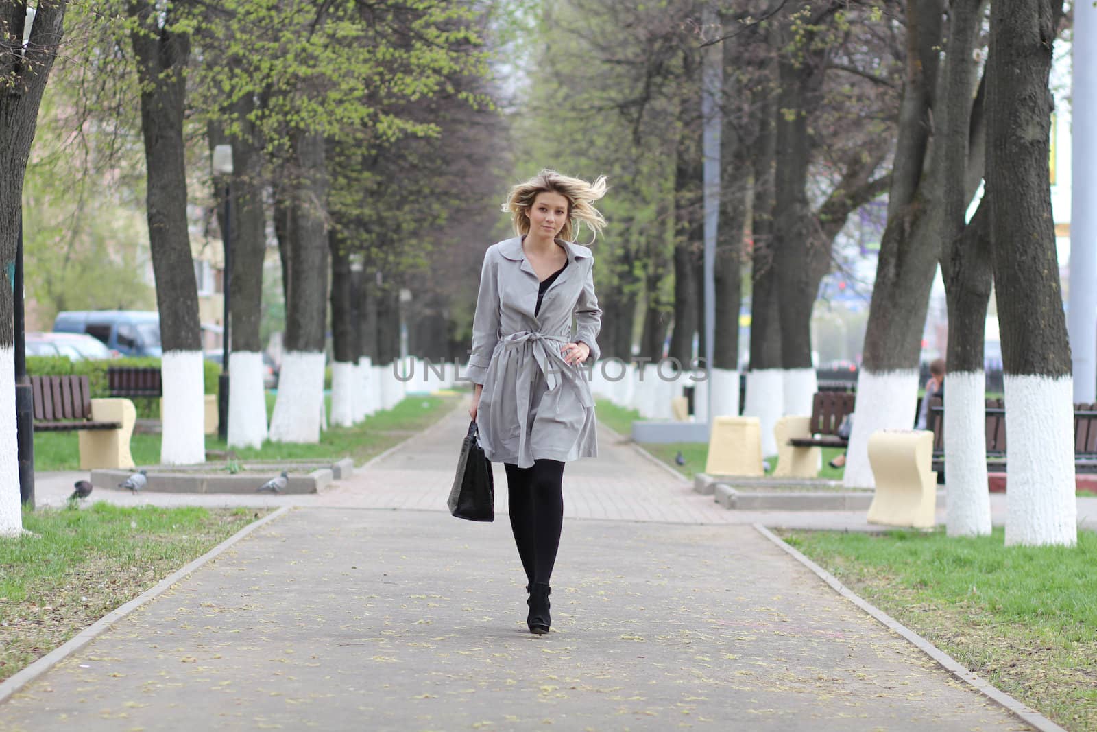 beautiful young woman walking on the street