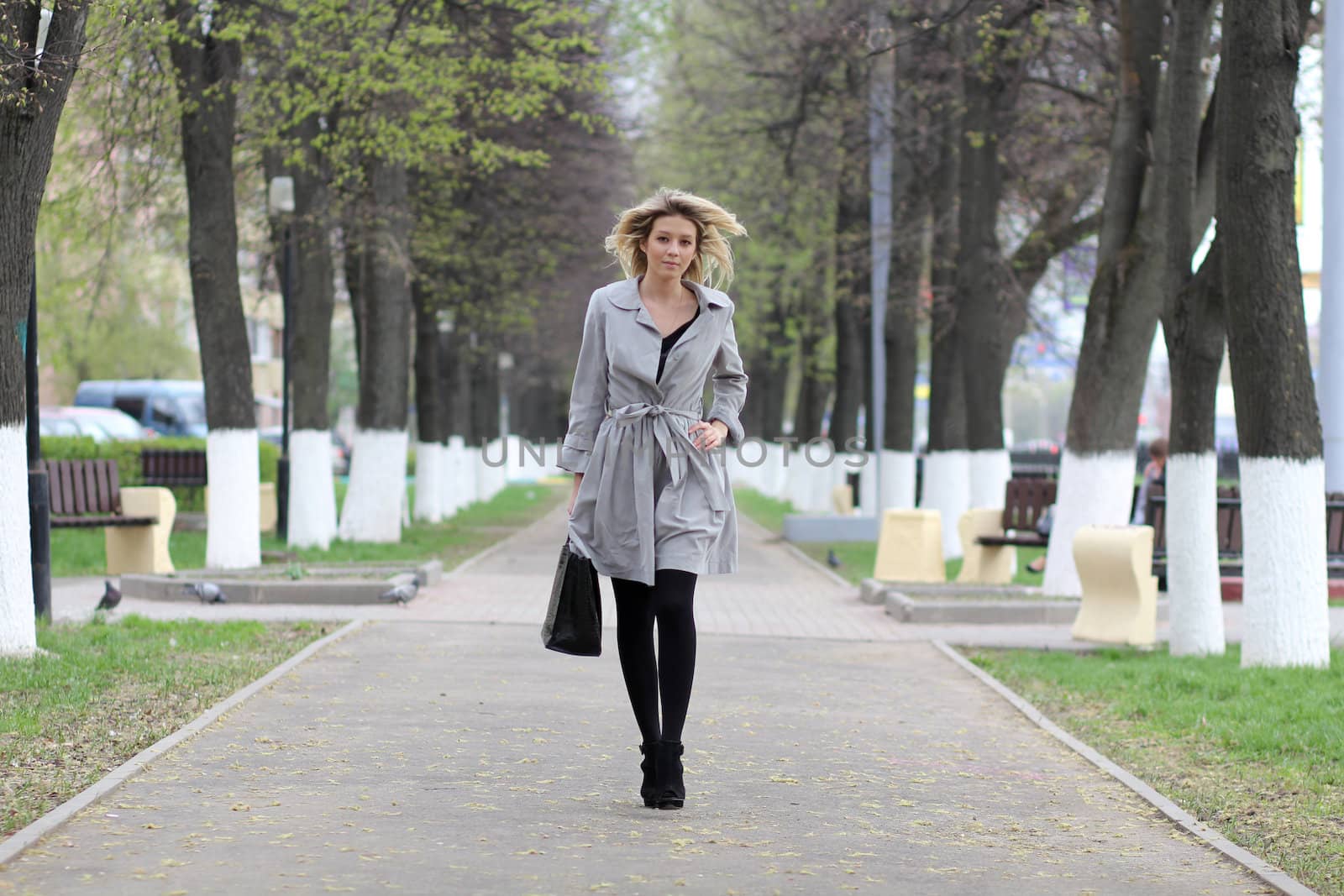 beautiful young woman walking on the street