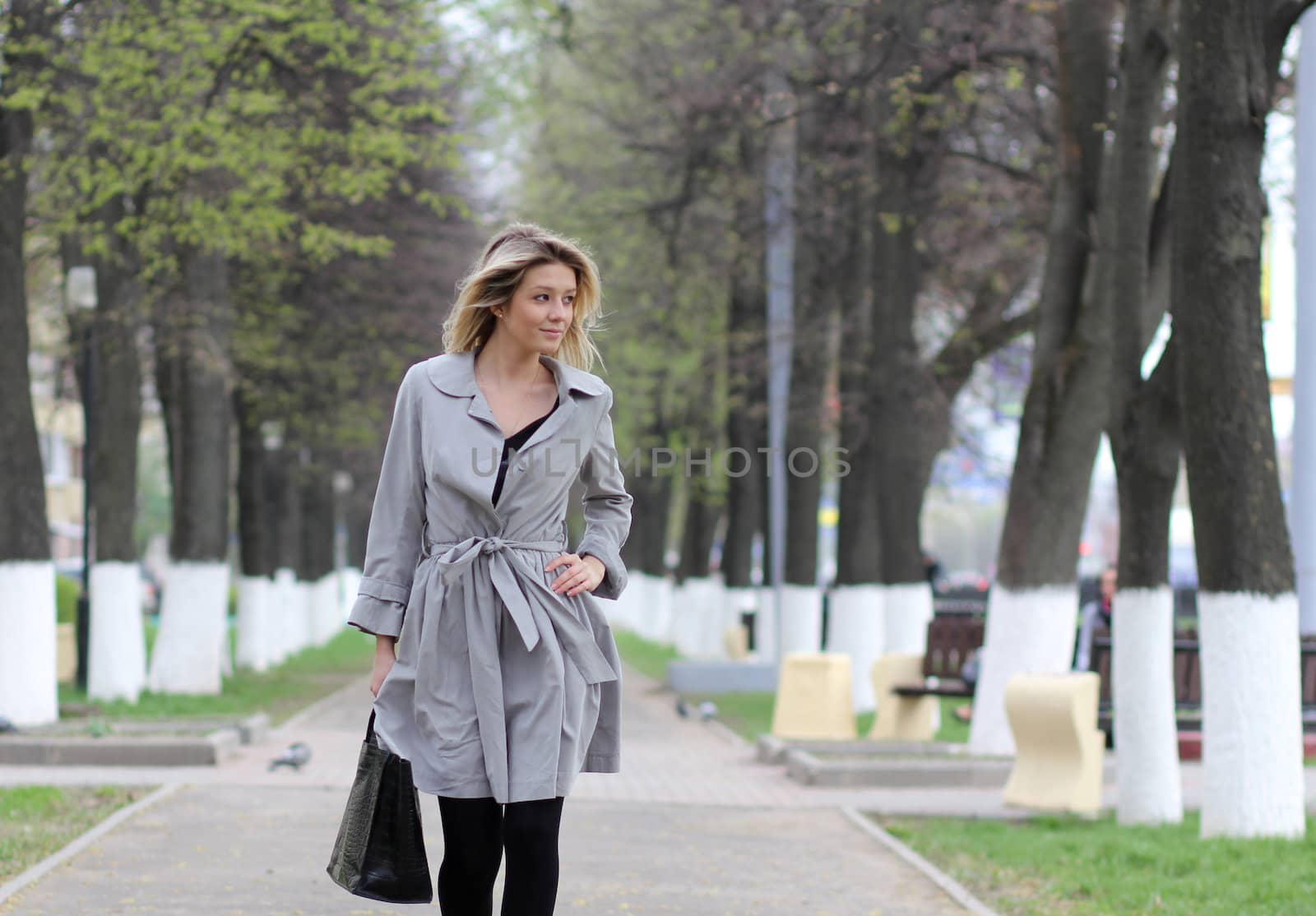 beautiful young woman walking on the street