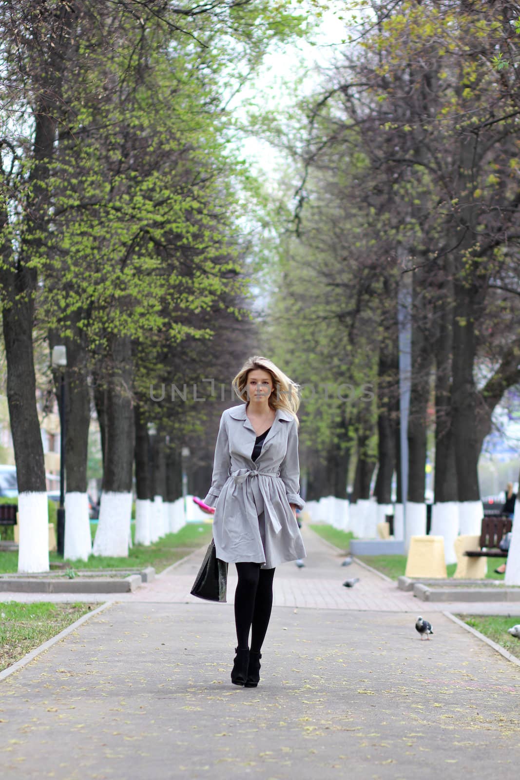 beautiful young woman walking on the street