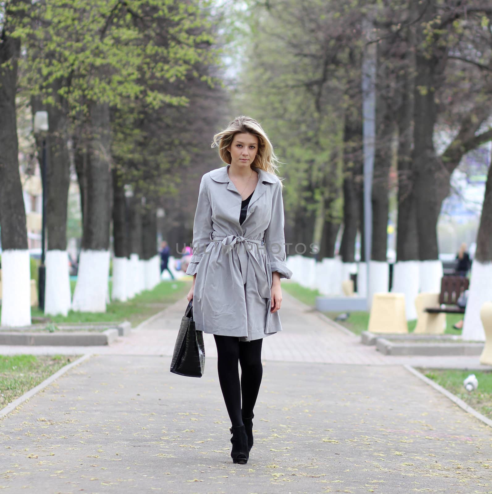 beautiful young woman walking on the street
