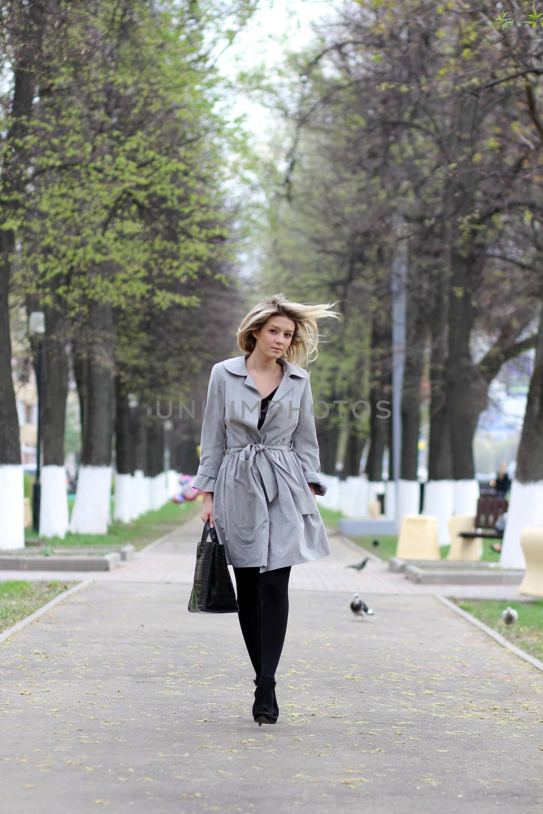 beautiful young woman walking on the street