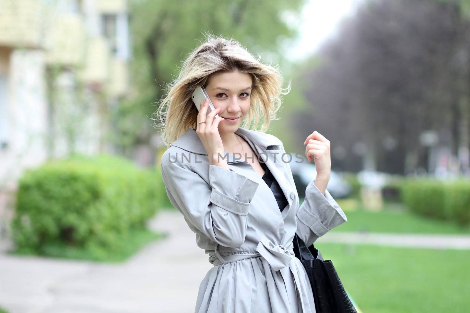 portrait of young woman talking on mobile phone