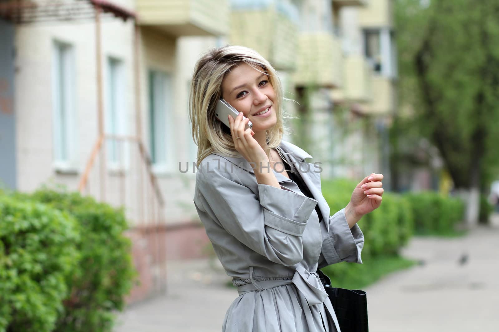 portrait of young woman talking on mobile phone
