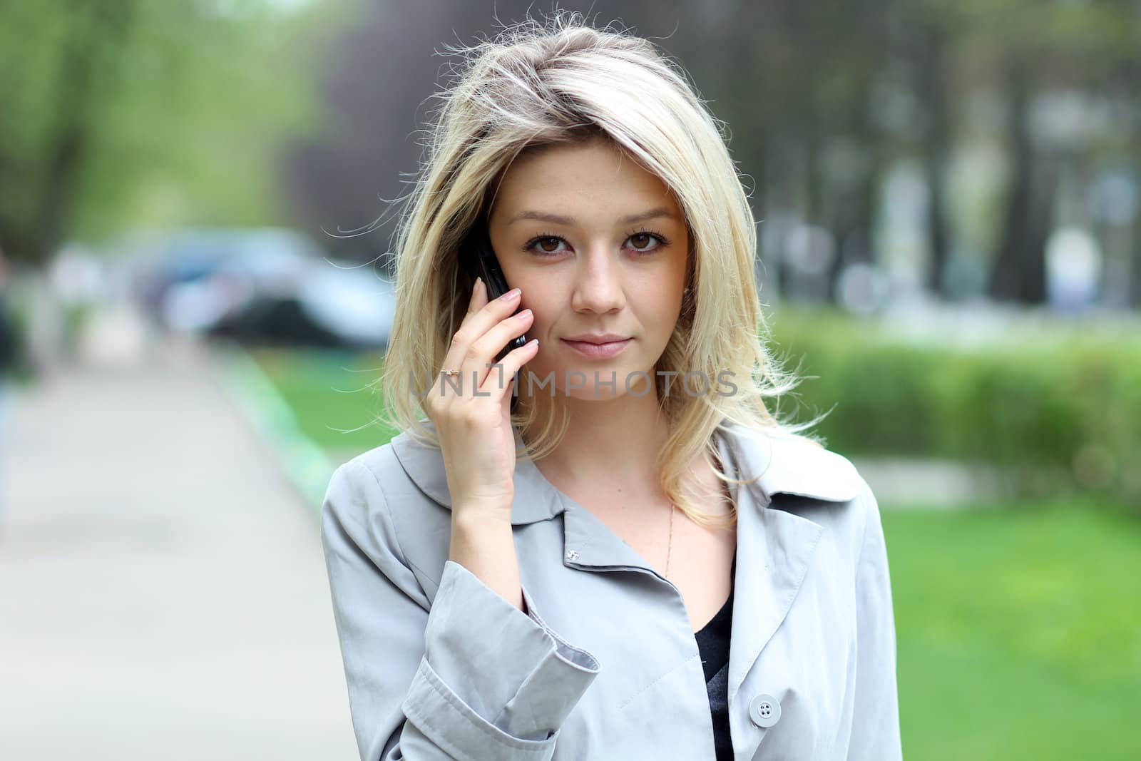 portrait of young woman talking on mobile phone