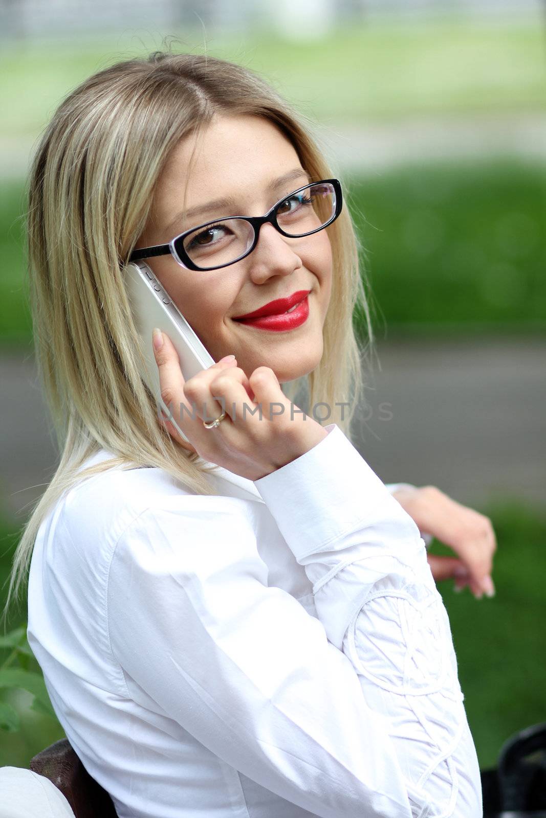portrait of young woman talking on mobile phone