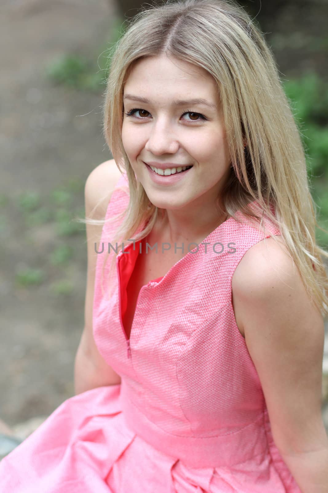 Beautiful young girl in pink dress