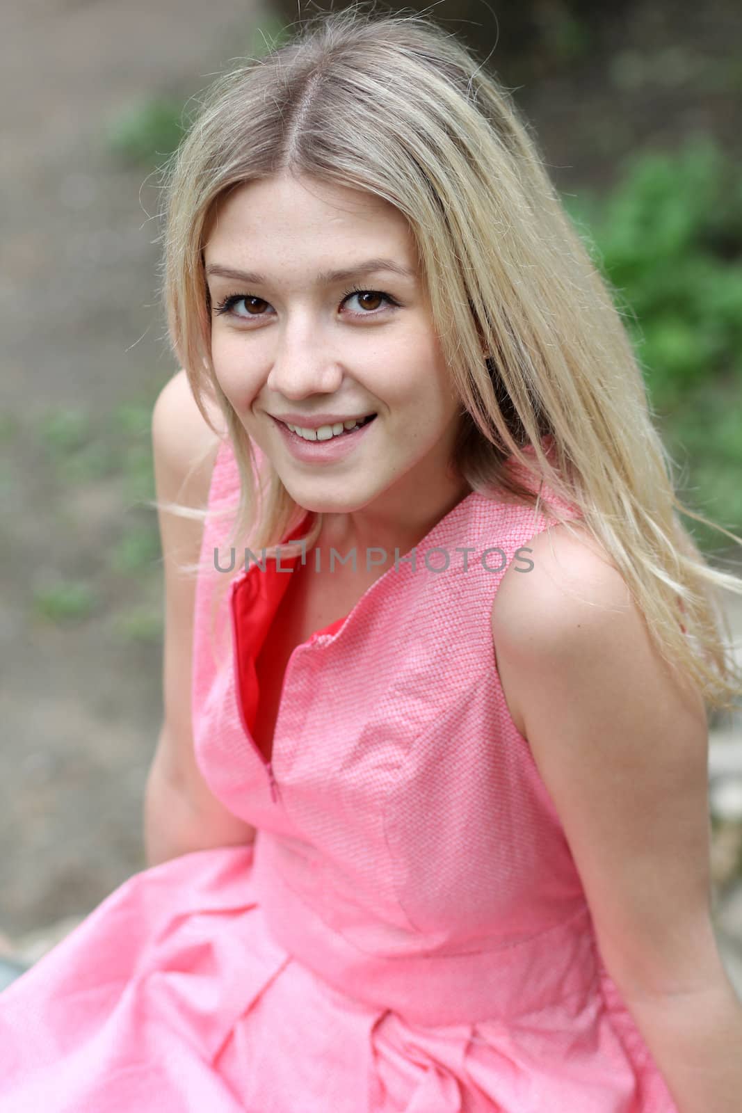 Beautiful young girl in pink dress