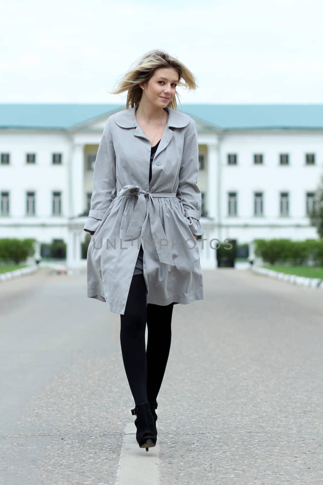 beautiful young woman walking on the street