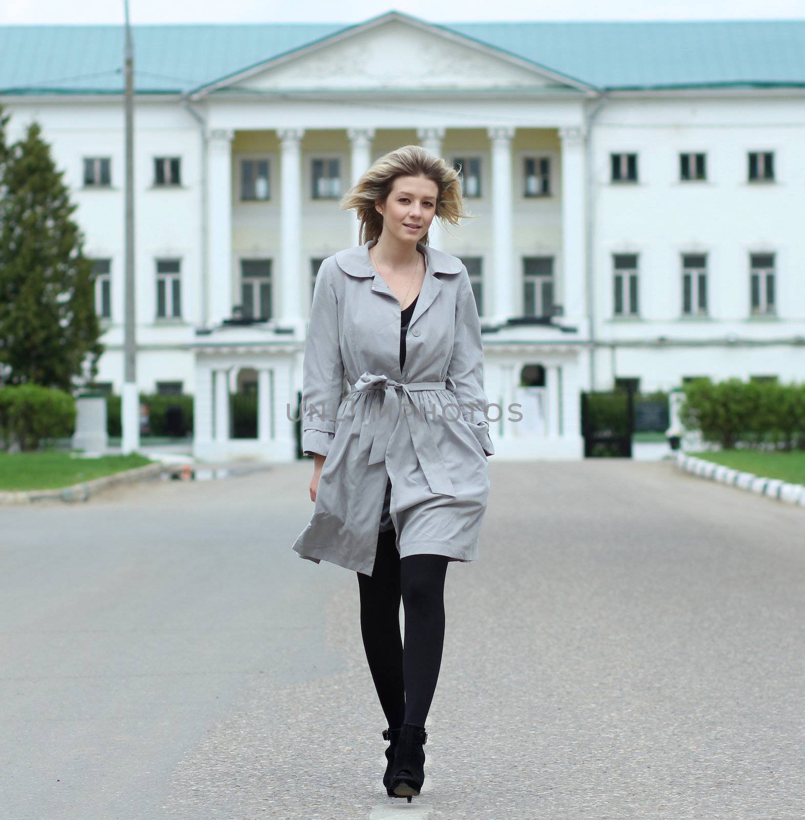 beautiful young woman walking on the street