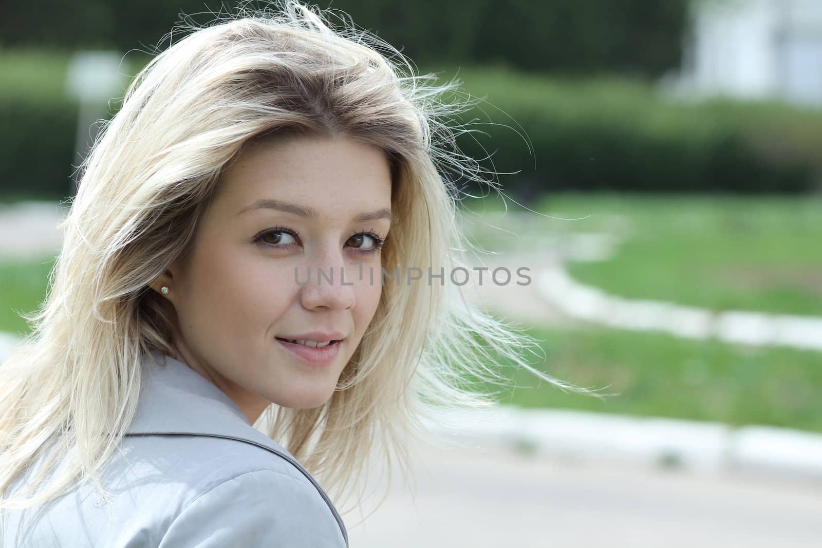 Beautiful young girl smiling. Outdoor portrait
