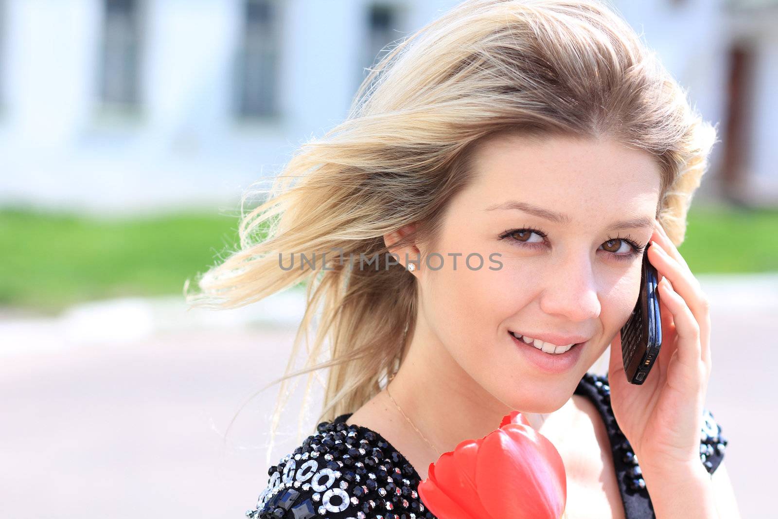 portrait of young woman talking on mobile phone
