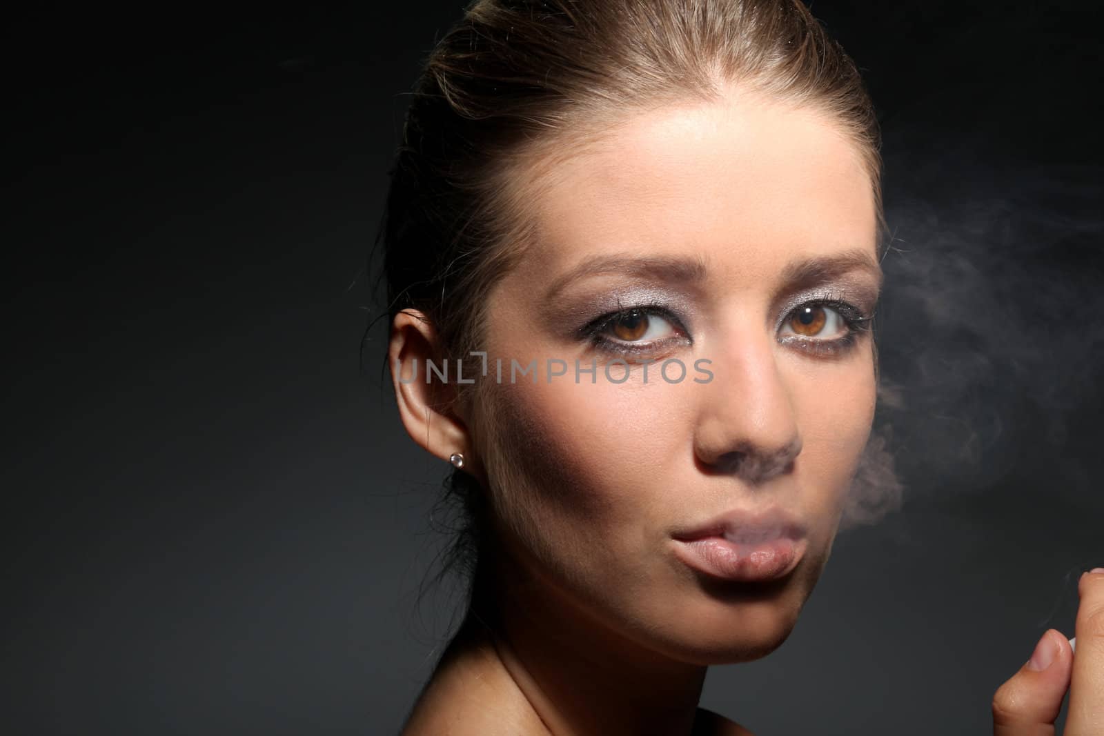 portrait of a girl in tobacco smoke