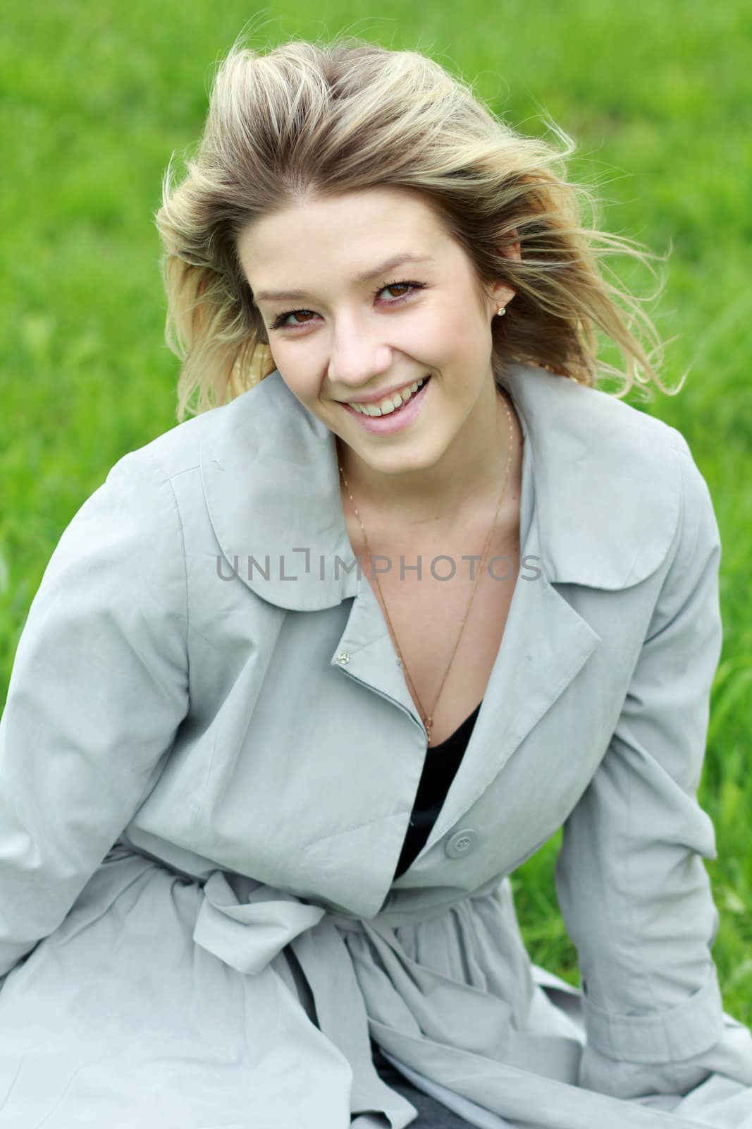 Portrait of beautiful blond in summer flowers
