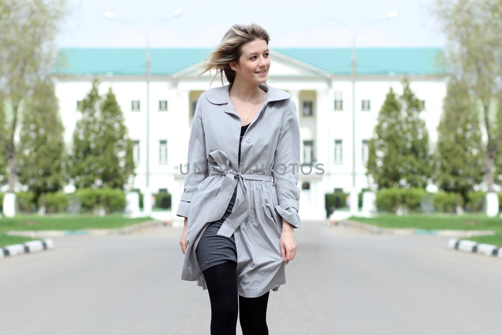 beautiful young woman walking on the street