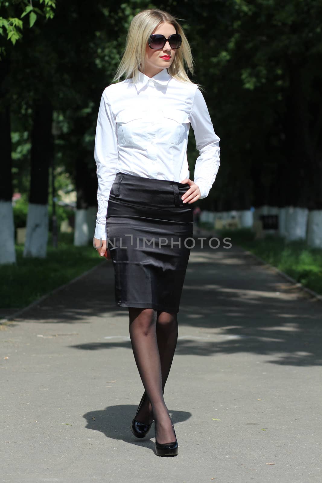 young business woman walking on the street