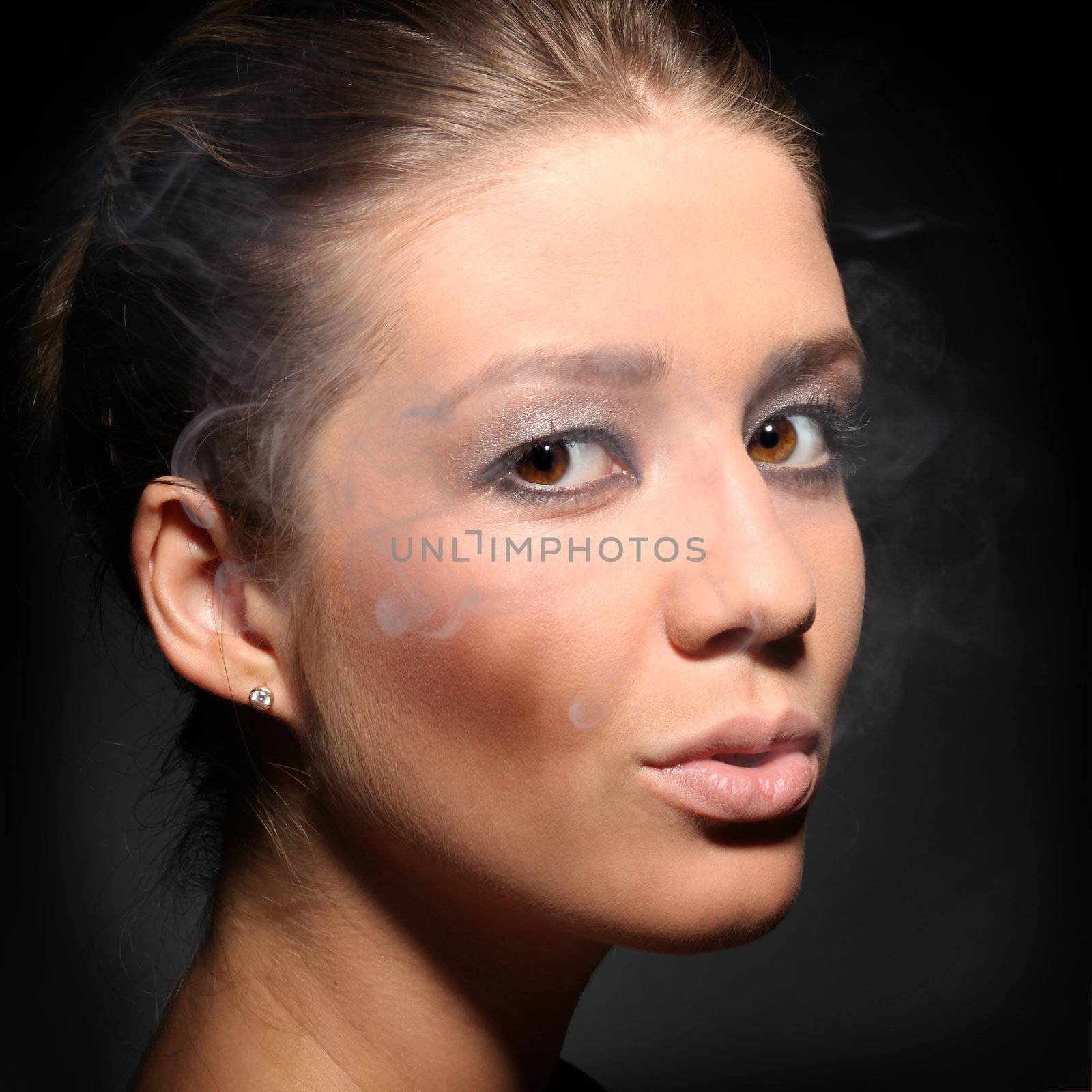 portrait of a girl in tobacco smoke