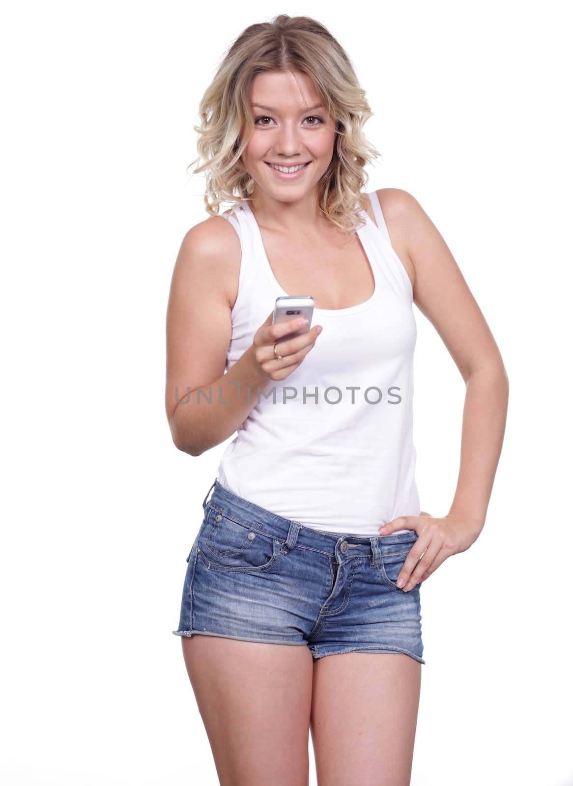 Young beautiful female reading on cell phone isolated on white background