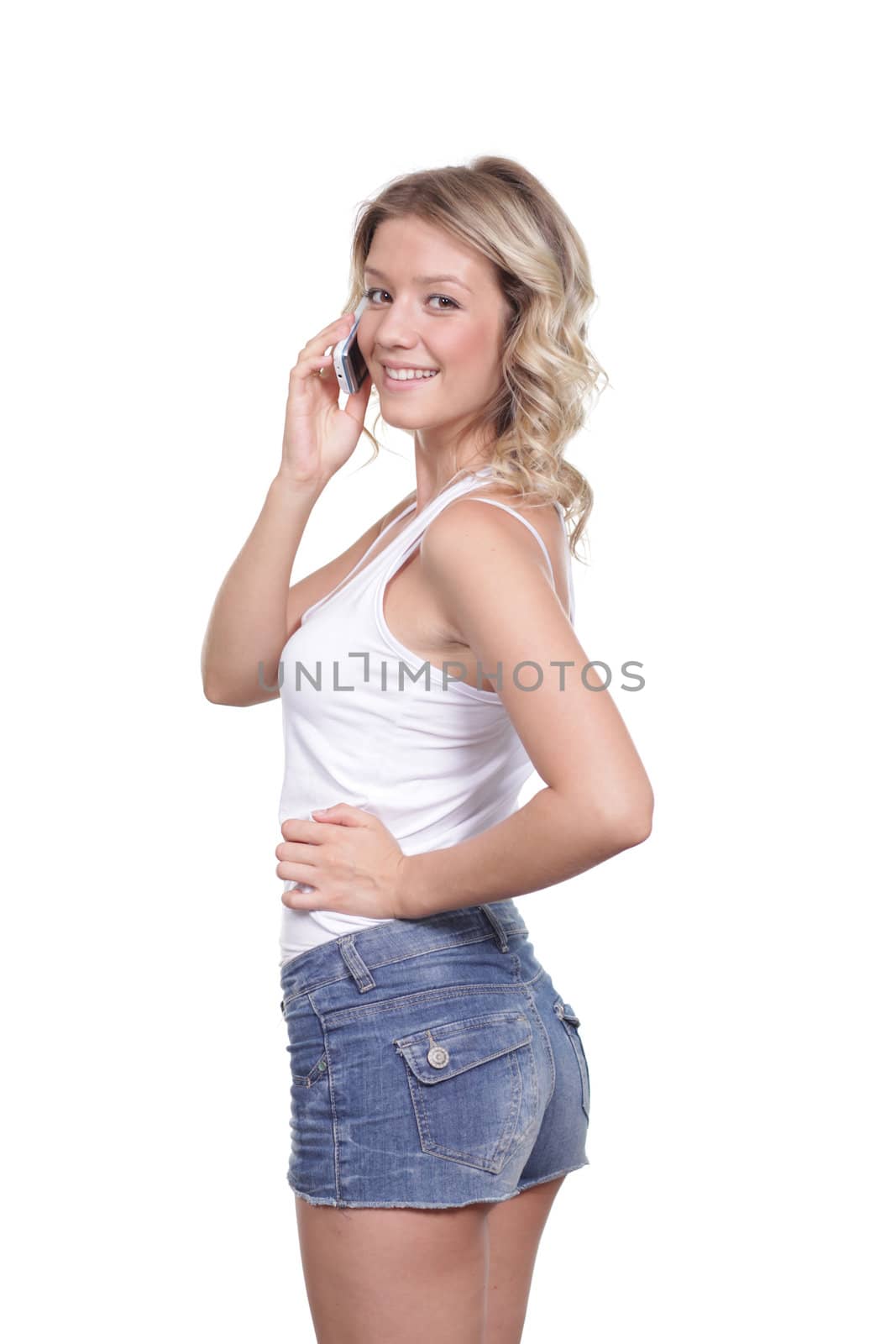 Young beautiful woman talking on cell phone