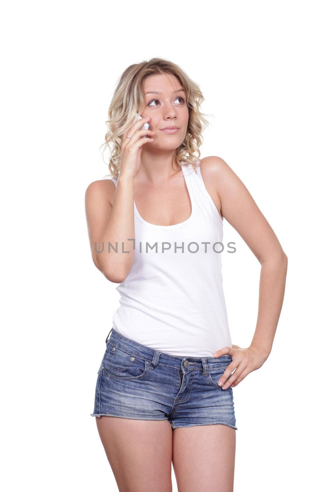 Young beautiful woman talking on cell phone