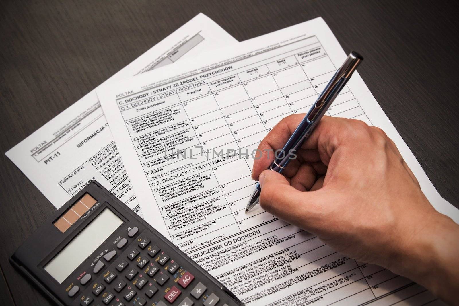 Man fills out polish tax form