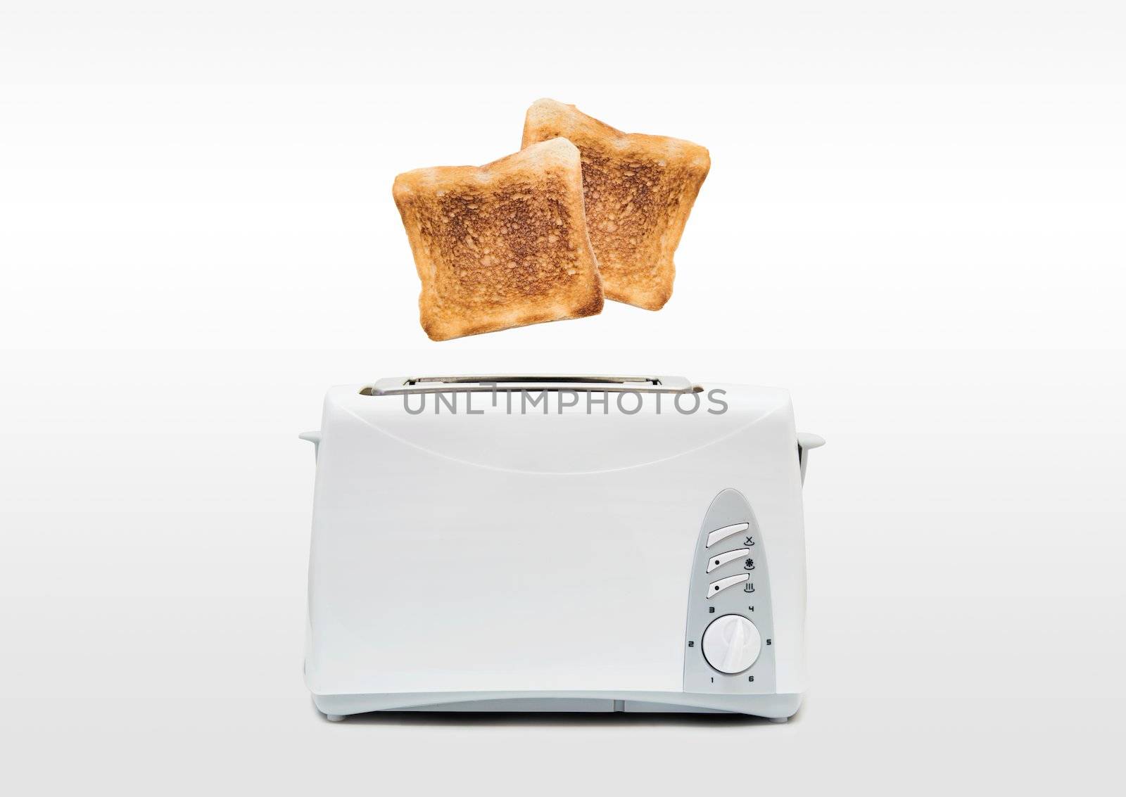 Jumping toasts. Preparing breakfast in modern toaster by simpson33