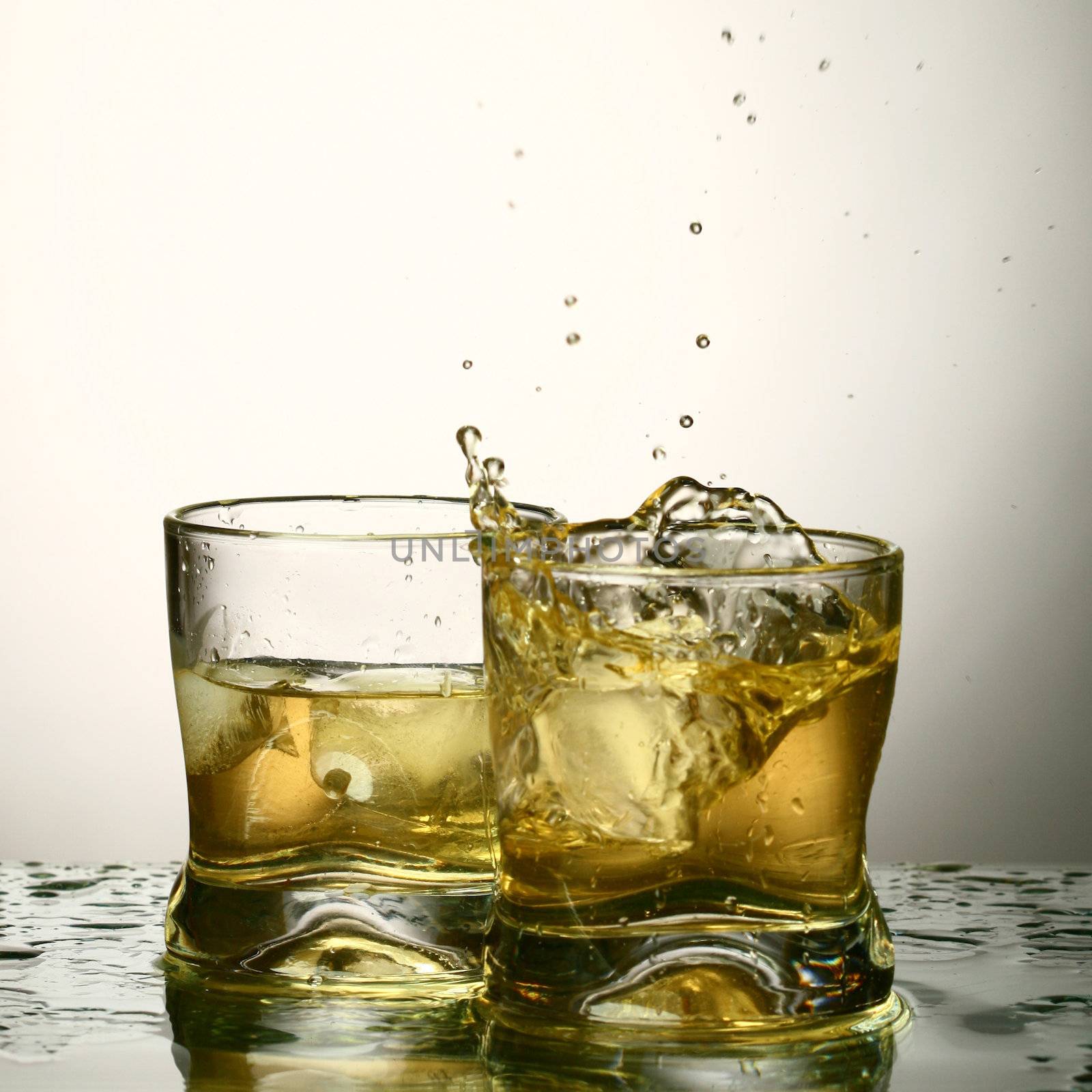 whiskey splash close up in dark