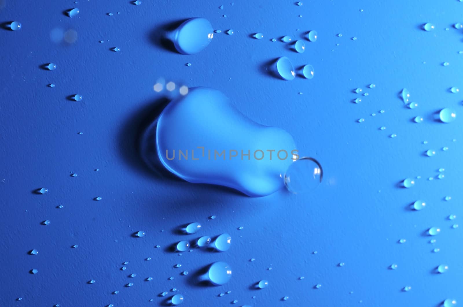 Some Water Drops on a Blue Textured Background