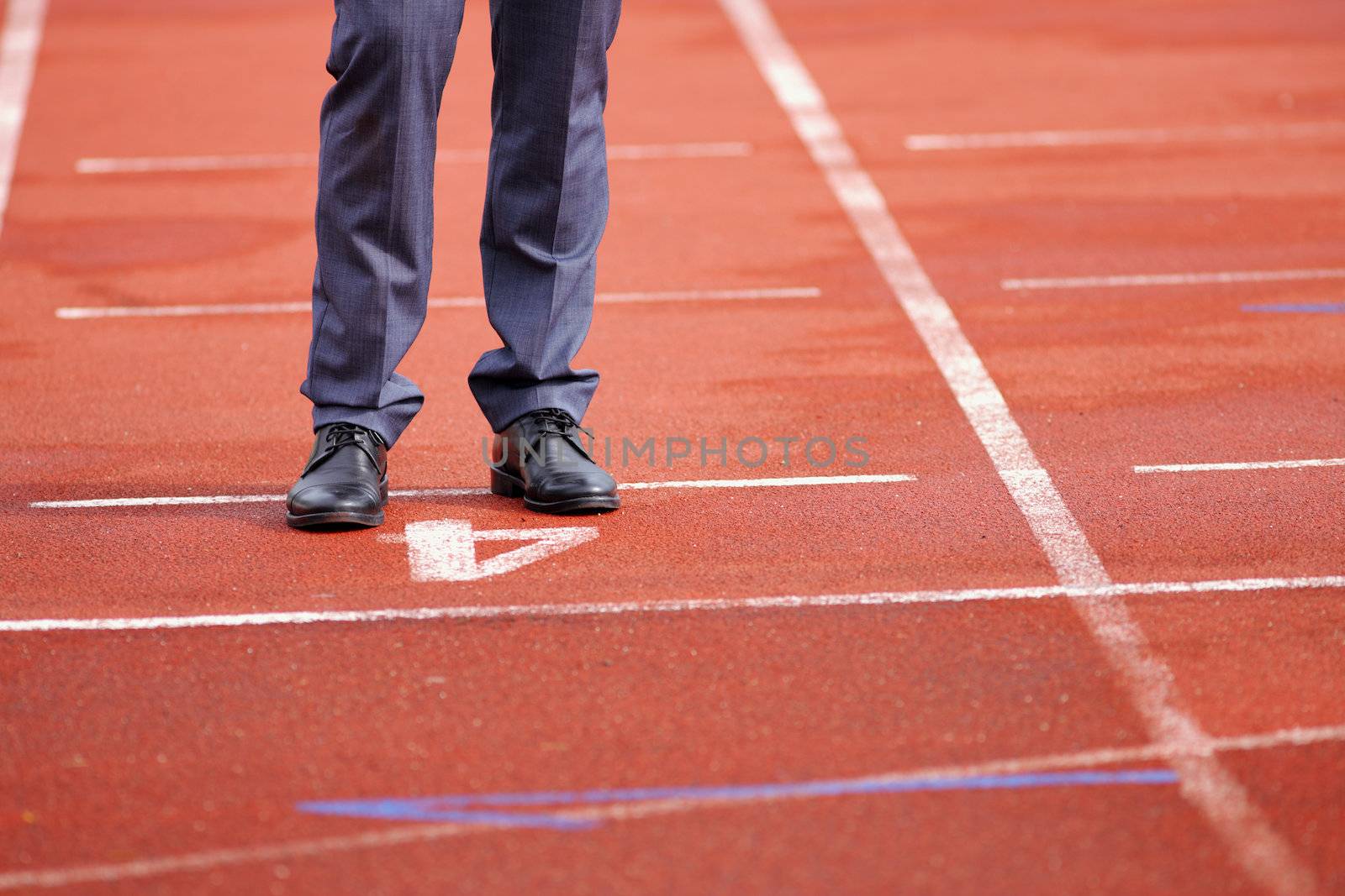 Businessman standing on the start line close up of shoes