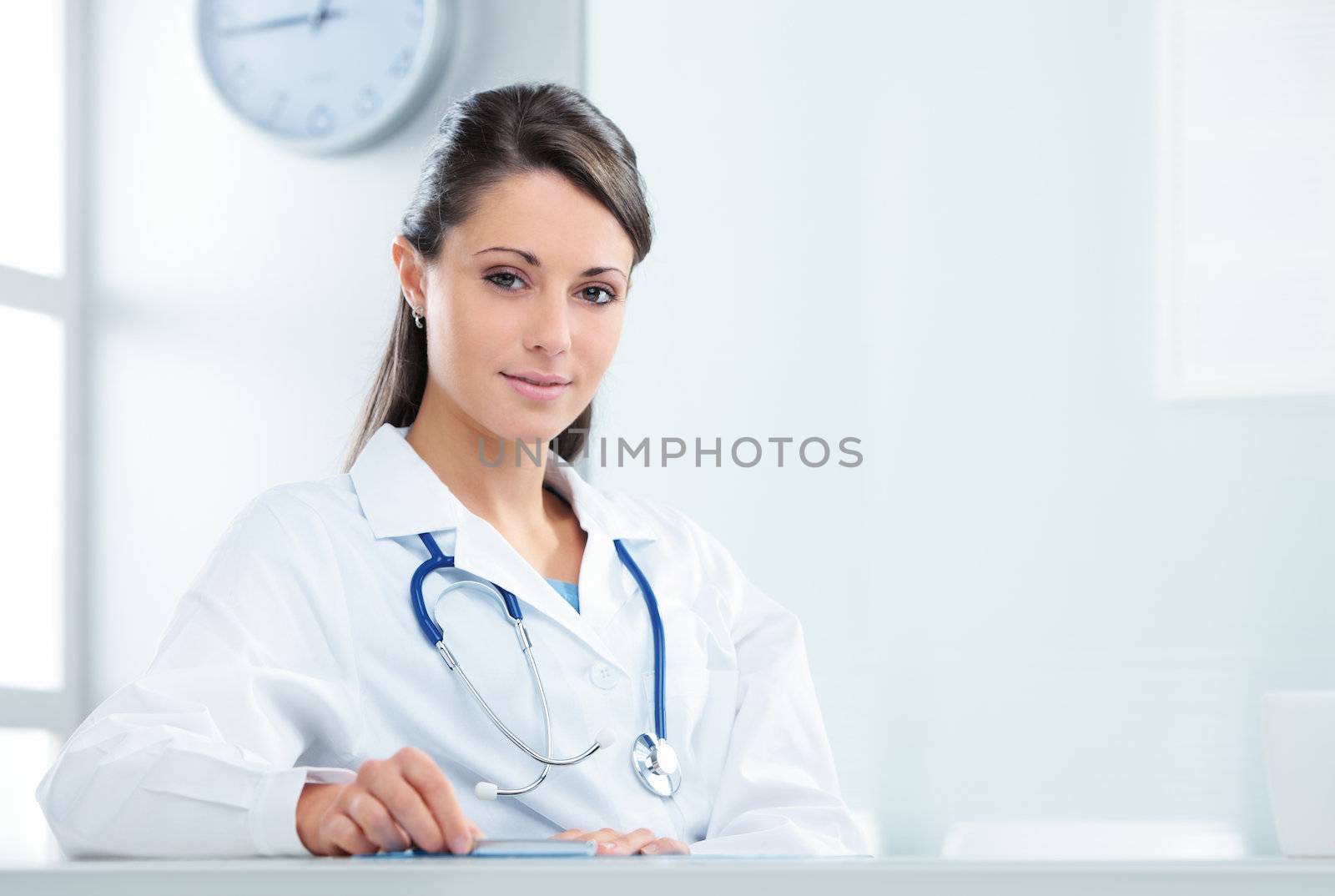 Portrait of a confident woman doctor sitting in her office