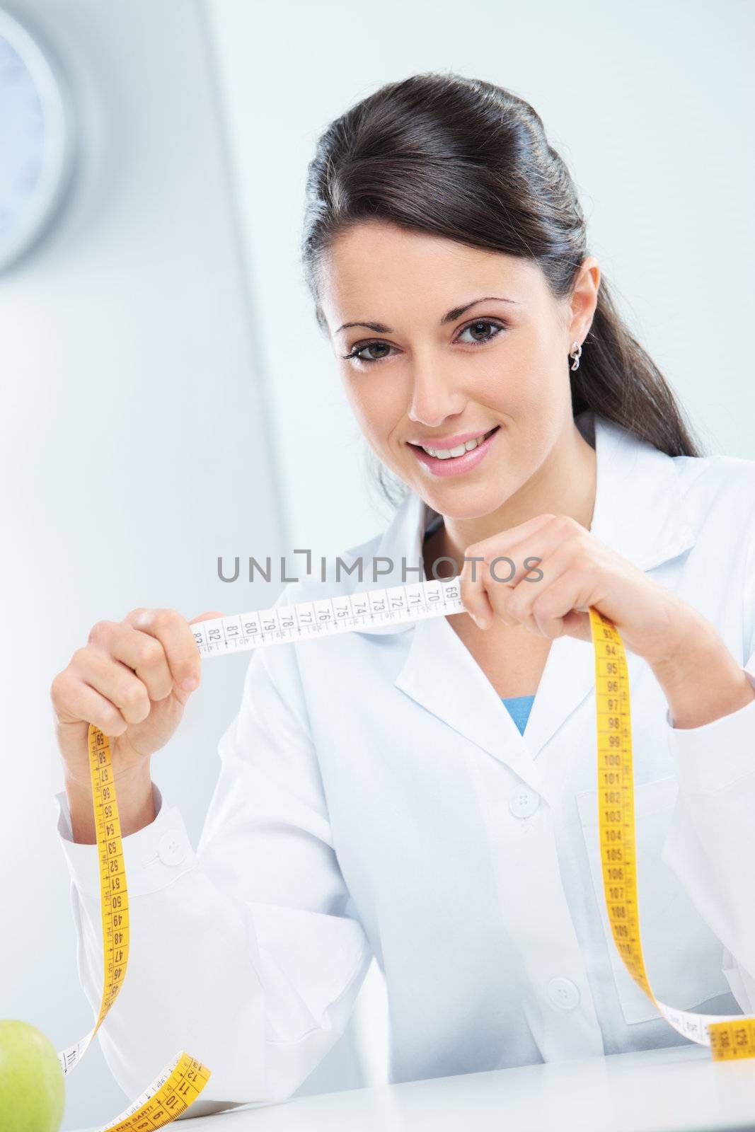 Nutritionist female Doctor in her office