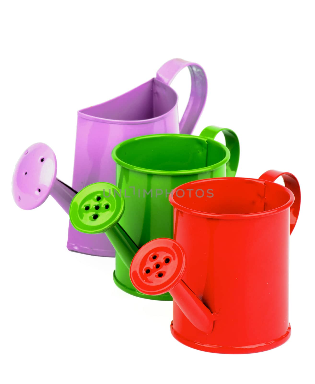 Arrangement of Red, Green and Purple Little Watering-Can isolated on white background