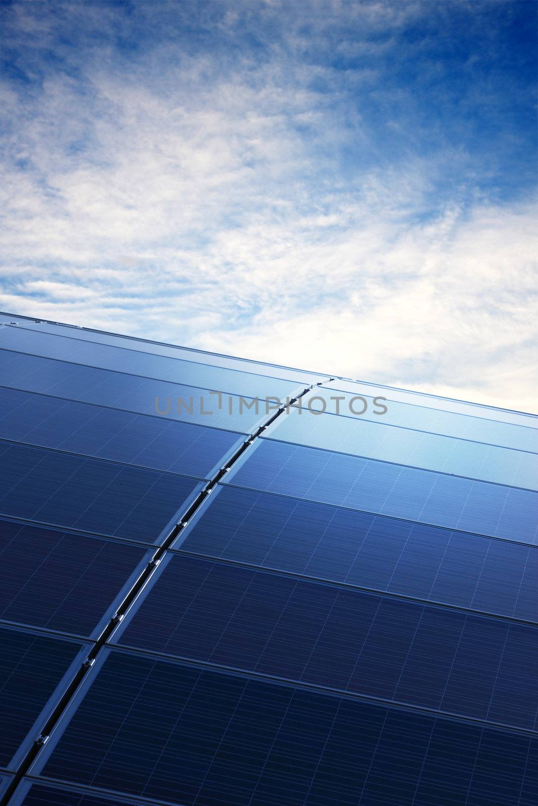 Green energy. Solar Panels in clear blue sky