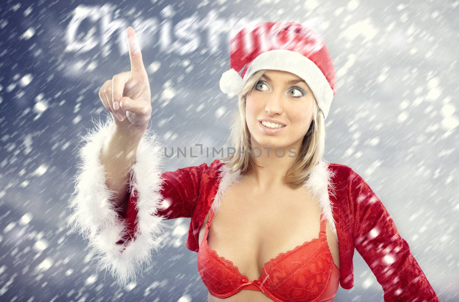 Smiling lady in the red Santa Claus costume under the heavy snowstorm reading Christmas snowy text