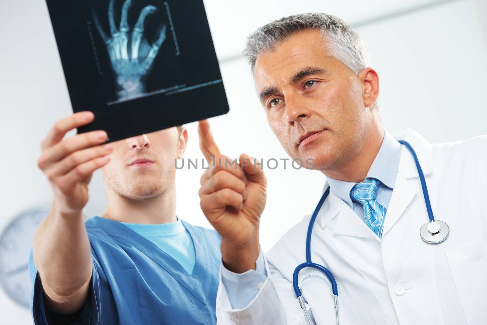 Medical team. Doctor and nurse looking at x ray