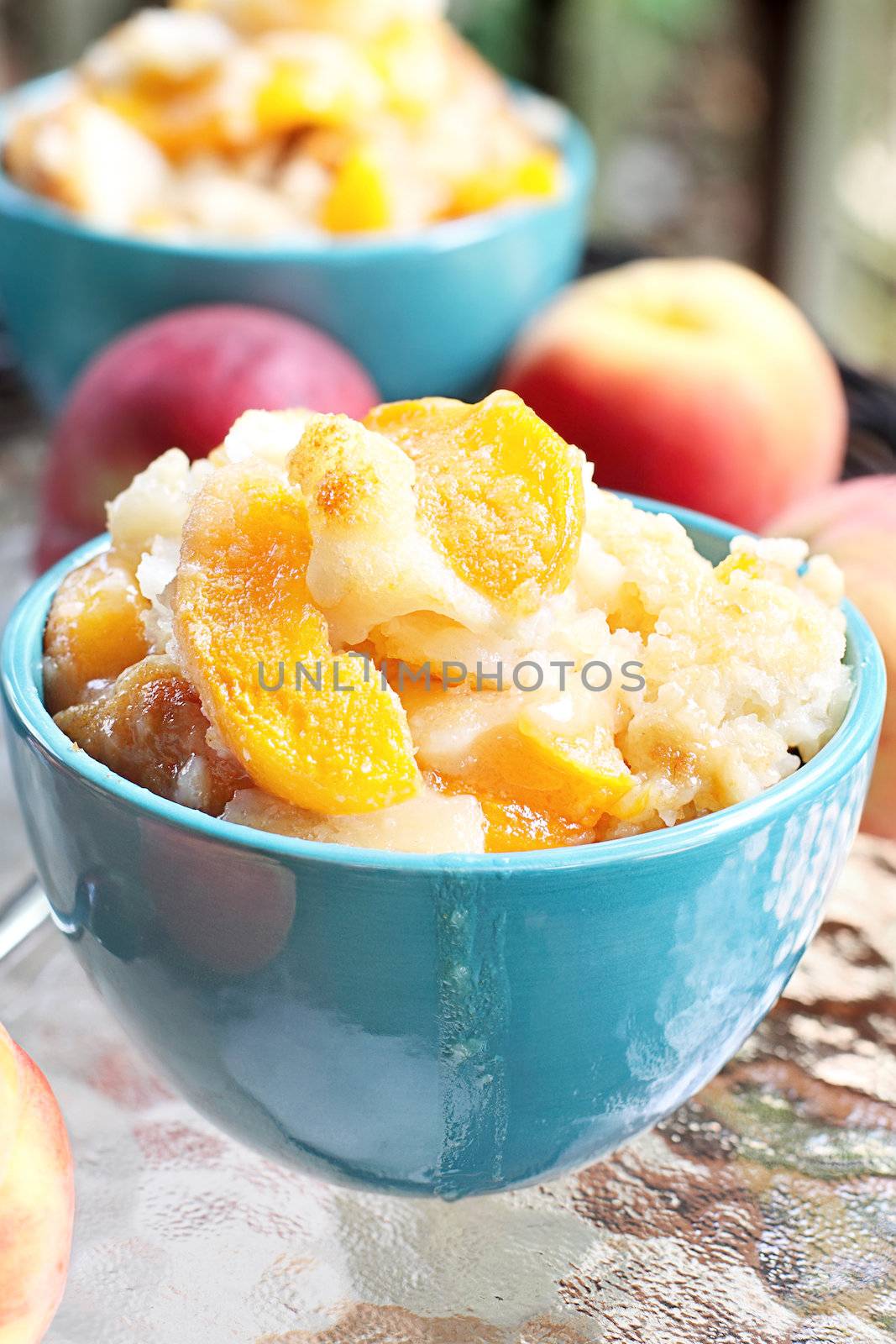 Fresh peach cobbler served outdoors.