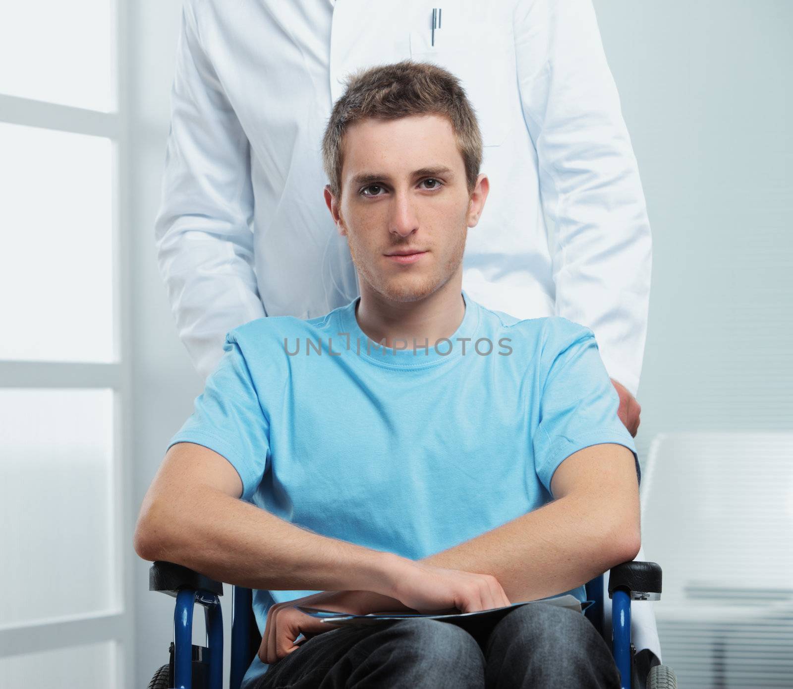 Male nurse pushing her patient on a wheelchair