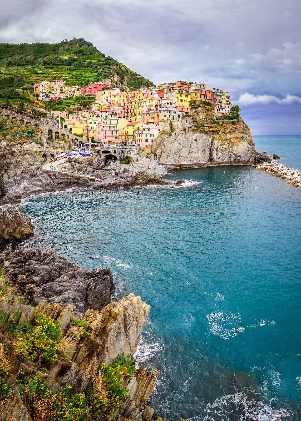 Scenic view of colorful village Manarola and ocean coast in Cinque Terre, Italy