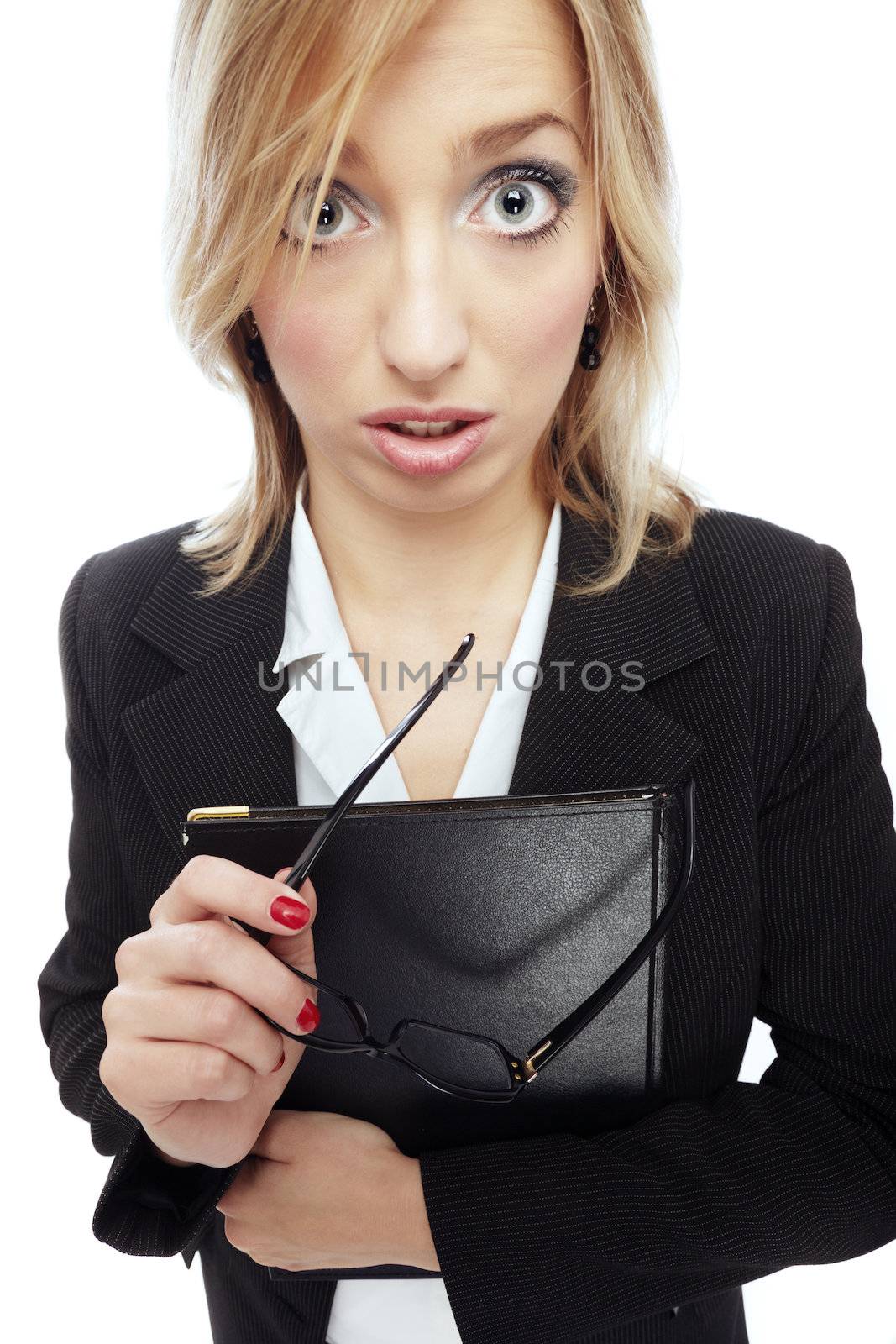Wide-angle photo of the astonished businesswoman holding folder and eyeglasses