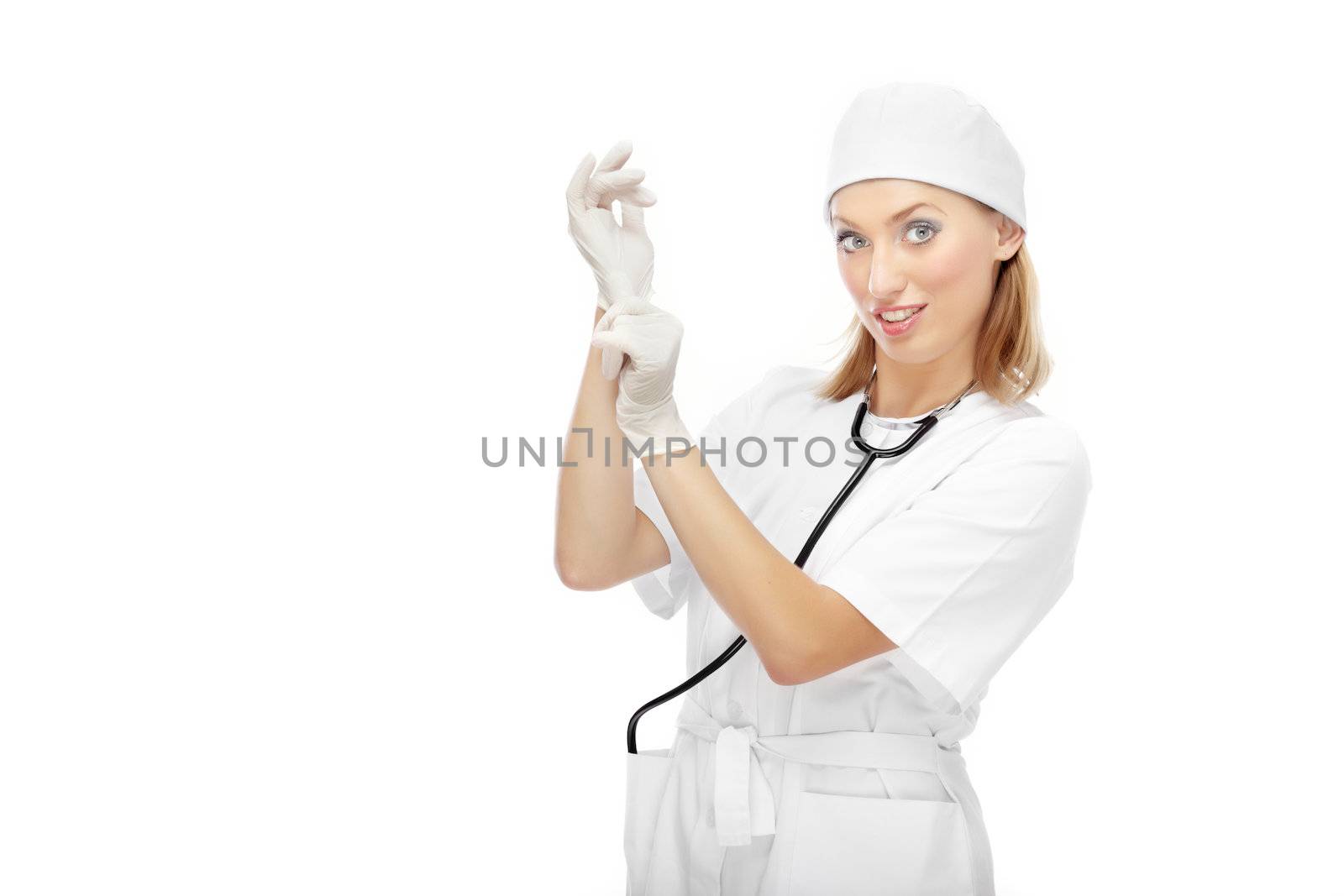 Pretty female doctor putting on the latex gloves