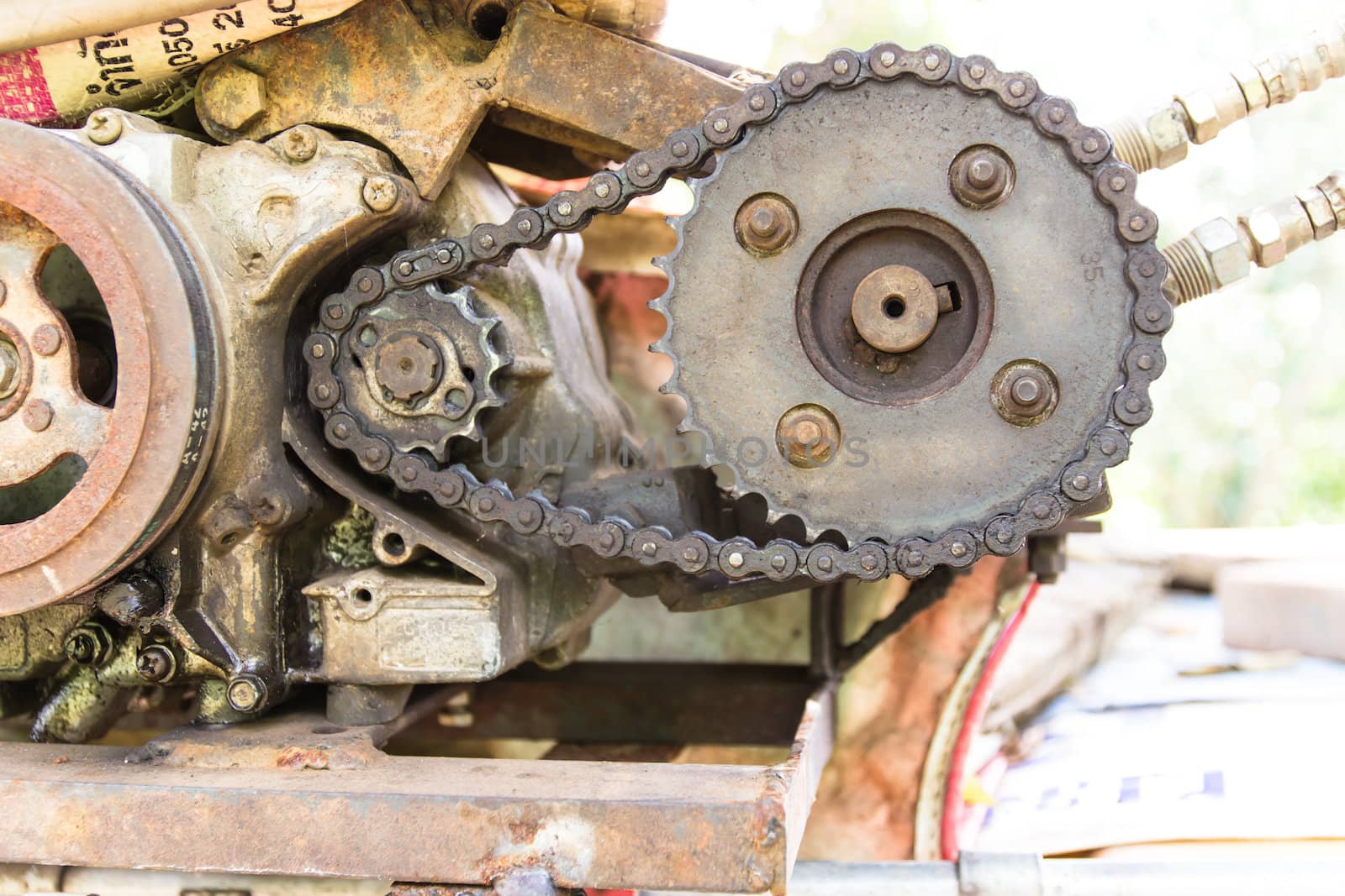 Old and rusty cogwheels with chain by photo2life