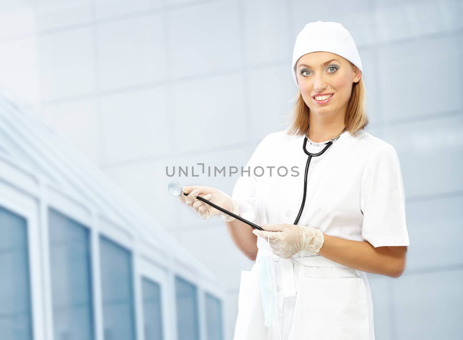 Smiling doctor indoors in uniform 